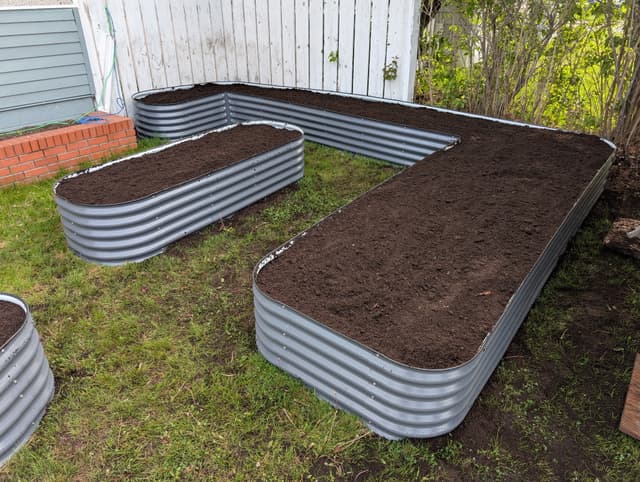 Newly filled raised garden beds with Garden Mix.